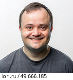 Smiling Man With Down Syndrome. Generative AI. Стоковое AI-изображение, AI-художник Roman Zavorotny / Фотобанк Лори