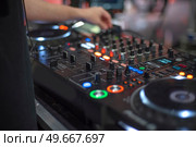 DJ mixing console. Tune in before a concert. Стоковое фото, агентство Ingram Publishing / Фотобанк Лори