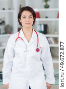 young female doctor in white uniform with stethoscope. Стоковое фото, агентство Ingram Publishing / Фотобанк Лори