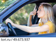 aggressive woman driving car shouting at someone. Стоковое фото, агентство Ingram Publishing / Фотобанк Лори