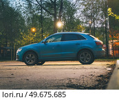 Audi RS Q3 luxury sporty SUV car parked on street in evening. Редакционное фото, фотограф Константин Григорьев / Фотобанк Лори
