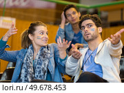 animated sport supporters wearing facepaint making hand gestures. Стоковое фото, агентство Ingram Publishing / Фотобанк Лори