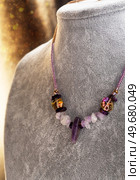 stylish  handmade author choker with amethyst. hobby and fashion concept. Стоковое фото, агентство Ingram Publishing / Фотобанк Лори