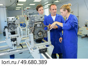 a female operative using machinery. Стоковое фото, агентство Ingram Publishing / Фотобанк Лори