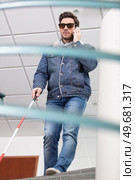 close up of blind person negotiating steps outdoors using cane. Стоковое фото, агентство Ingram Publishing / Фотобанк Лори