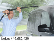 car washing with hi pressured water. Стоковое фото, агентство Ingram Publishing / Фотобанк Лори