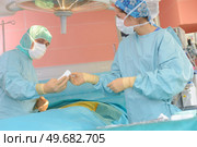 young surgery team in the operating room. Стоковое фото, агентство Ingram Publishing / Фотобанк Лори
