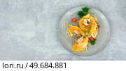 Spaghetti nests baked with meatballs and cheese. Casserole,space for text. Spaghetti baked with meatballs. Стоковое фото, агентство Ingram Publishing / Фотобанк Лори