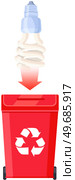 Waste electrical and electronic equipment. Used energy saving light bulb for recycling. Light bulb near waste bin with recycling logo. Protection of nature and ecology, reasonable energy consumption. Used energy saving light bulb for recycling. Electrical equipment reuse for eco protection. Стоковая иллюстрация, агентство Ingram Publishing / Фотобанк Лори