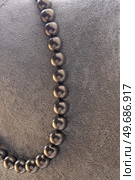 author beautiful  steel color pearls necklaces with heart pendant demonstrated on maneken. fashion and jewelry concept. Стоковое фото, агентство Ingram Publishing / Фотобанк Лори