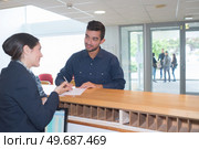 man doing checkin at a hotel. Стоковое фото, агентство Ingram Publishing / Фотобанк Лори