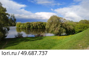 Hilly area around natural reservoir. Winding river among forests and meadows. Beautiful spring wildlife. Vast green expanses. Natural landscape. Стоковое фото, фотограф Ирина / Фотобанк Лори