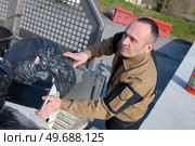 municipal dustman worker with cleaning tools in public streets. Стоковое фото, агентство Ingram Publishing / Фотобанк Лори