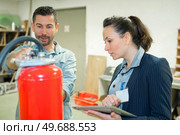 safety inspector inspecting industrial workshop. Стоковое фото, агентство Ingram Publishing / Фотобанк Лори