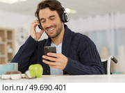 young handsome man in wheelchair on the phone. Стоковое фото, агентство Ingram Publishing / Фотобанк Лори