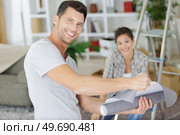 young couple happy in a new house. Стоковое фото, агентство Ingram Publishing / Фотобанк Лори