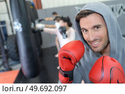 portrait of male boxer celebrating victory. Стоковое фото, агентство Ingram Publishing / Фотобанк Лори