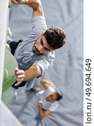 close up of a climber indoors. Стоковое фото, агентство Ingram Publishing / Фотобанк Лори