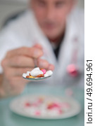 portait of senior and spoonful of medicines. Стоковое фото, агентство Ingram Publishing / Фотобанк Лори