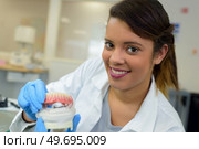 artificial denture technician posing. Стоковое фото, агентство Ingram Publishing / Фотобанк Лори