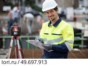 portrait of a geometer on a construction site. Стоковое фото, агентство Ingram Publishing / Фотобанк Лори