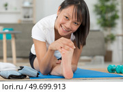 women doing exercises aerobics warming up with gymnastics for flexibility. Стоковое фото, агентство Ingram Publishing / Фотобанк Лори