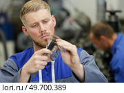an apprentice using vernier gauage. Стоковое фото, агентство Ingram Publishing / Фотобанк Лори