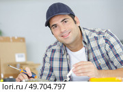 a professional handyman at work. Стоковое фото, агентство Ingram Publishing / Фотобанк Лори