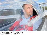 Man in cockpit of glider. Стоковое фото, агентство Ingram Publishing / Фотобанк Лори