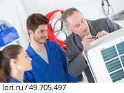 young apprentices electrician. Стоковое фото, агентство Ingram Publishing / Фотобанк Лори