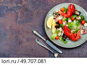 Appetizing salad of oysters, mussels, lobster and vegetables. Ketogenic. Italian mixed seafood salad. Стоковое фото, агентство Ingram Publishing / Фотобанк Лори