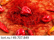 Spicy seasoning, spice, cut from red pepper. Thinly sliced pepper.. Hot red pepper spice. Стоковое фото, агентство Ingram Publishing / Фотобанк Лори