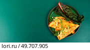 Tasty omelet with green asparagus, sauce and microgreens. Banner. Copy space.. Omelet with greens, space for text. Стоковое фото, агентство Ingram Publishing / Фотобанк Лори