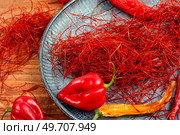 Spicy seasoning, spice, cut from red pepper. Thinly sliced pepper.. Hot red pepper spice. Стоковое фото, агентство Ingram Publishing / Фотобанк Лори