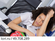 stressed businesswoman working in office. Стоковое фото, агентство Ingram Publishing / Фотобанк Лори