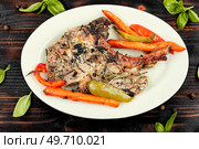 Fried tomahawk pork meat steak. Roasted pork tomahawk steak. Стоковое фото, агентство Ingram Publishing / Фотобанк Лори