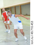 team of men during game of pala. Стоковое фото, агентство Ingram Publishing / Фотобанк Лори