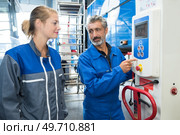 a female operative using machinery. Стоковое фото, агентство Ingram Publishing / Фотобанк Лори