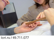woman hands with beautiful fingernails and a nail file. Стоковое фото, агентство Ingram Publishing / Фотобанк Лори
