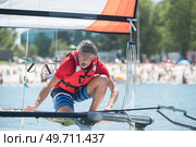 professional waterman training on lake with catamaran. Стоковое фото, агентство Ingram Publishing / Фотобанк Лори
