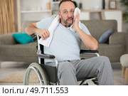 disabled man wiping sweat from his brow after exercising. Стоковое фото, агентство Ingram Publishing / Фотобанк Лори