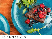 Fried beef fillet medallion steak with berry sauce on the table. Barbecue.. Beef steak in berry sauce. Стоковое фото, агентство Ingram Publishing / Фотобанк Лори