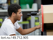 man with table football soccer game. Стоковое фото, агентство Ingram Publishing / Фотобанк Лори