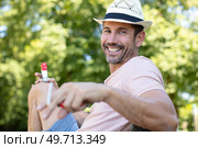 a ma smokes a cigarette outdoors. Стоковое фото, агентство Ingram Publishing / Фотобанк Лори