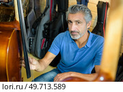 portrait of man with double bass. Стоковое фото, агентство Ingram Publishing / Фотобанк Лори