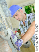 Construction worker in a house. Стоковое фото, агентство Ingram Publishing / Фотобанк Лори