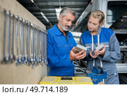 confident employees of maintenance in protective wear. Стоковое фото, агентство Ingram Publishing / Фотобанк Лори