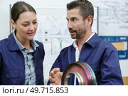 airplane service crew repairing something. Стоковое фото, агентство Ingram Publishing / Фотобанк Лори