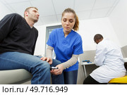 doctor neurologist examining female patient. Стоковое фото, агентство Ingram Publishing / Фотобанк Лори