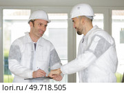 portrait of inspectors inside the building. Стоковое фото, агентство Ingram Publishing / Фотобанк Лори
